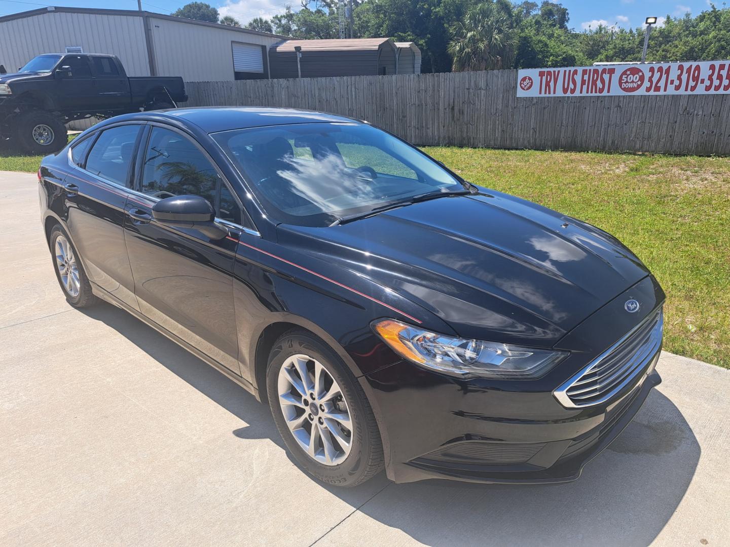 2017 Black /BLACK Ford Fusion SE (3FA6P0HD8HR) with an 1.5L L4 DOHC 16V engine, 6A transmission, located at 1181 Aurora Rd, Melbourne, FL, 32935, (321) 241-1100, 28.132914, -80.639175 - Photo#1